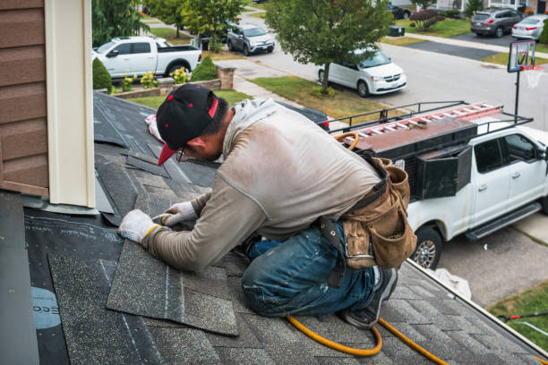 Professional Roofing technician working in Voltaire, ND